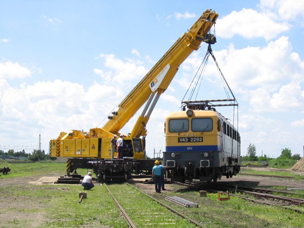 railway crane lifts wagon